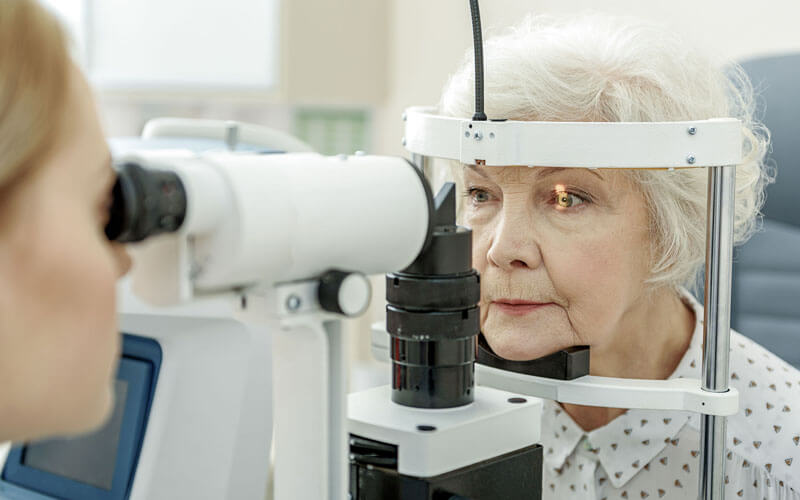 An image of a patient being checked for eye disease at the Boca Raton's Correct Vision eye Care Center. 