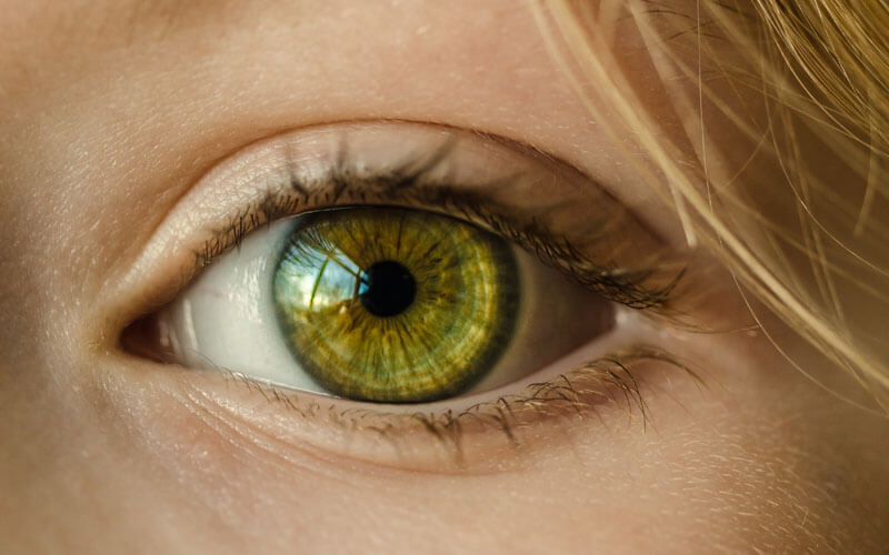 An image of a patient's eye close-up during an eye exam at Correct Vision of Boca Raton with a link to the eye exam page.